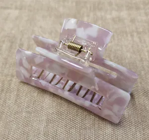 Hovedbilde H&aring;rspenne lilla marmorert plast